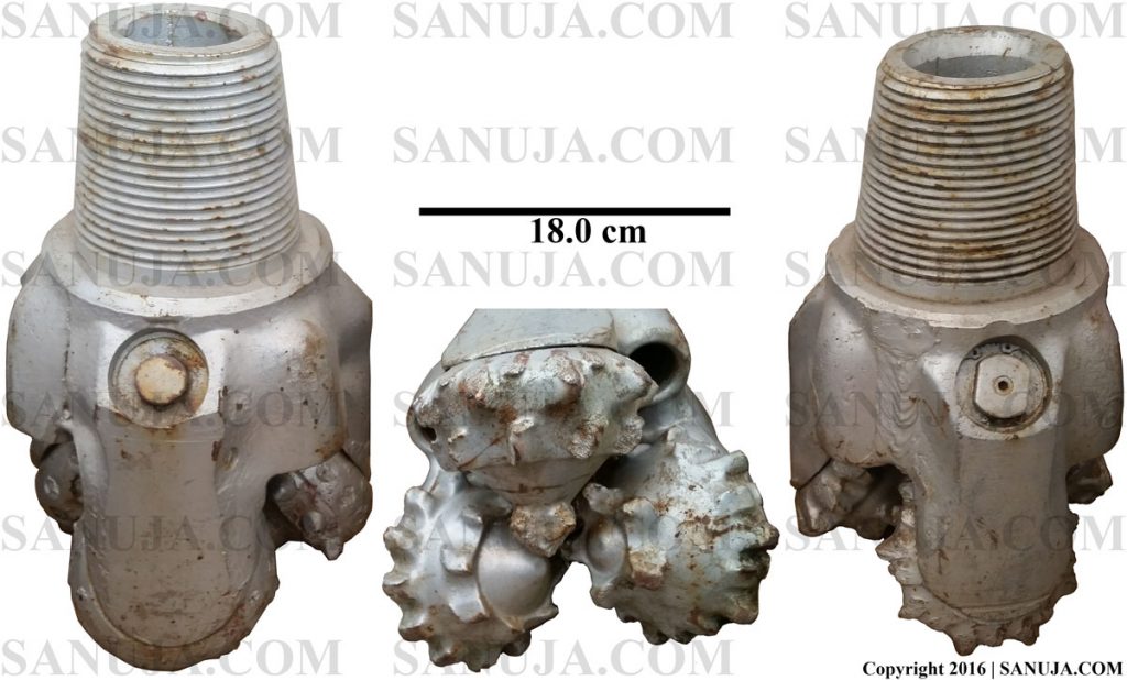 A typical drilling bit. This type of bit will result in faster drilling rates, but will not yield useful core samples. This particular size is associated with initial drilling. Bit size decreases with increasing depth.